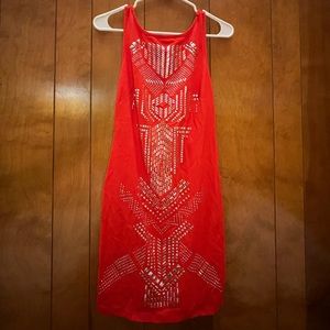 Tight red mini dress with cool silver embellishments.